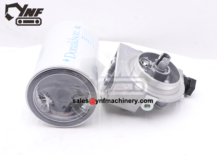 Fuel filter element with housing base for diesel engine service