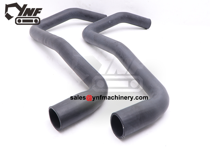 Excavator radiator hose replacement component