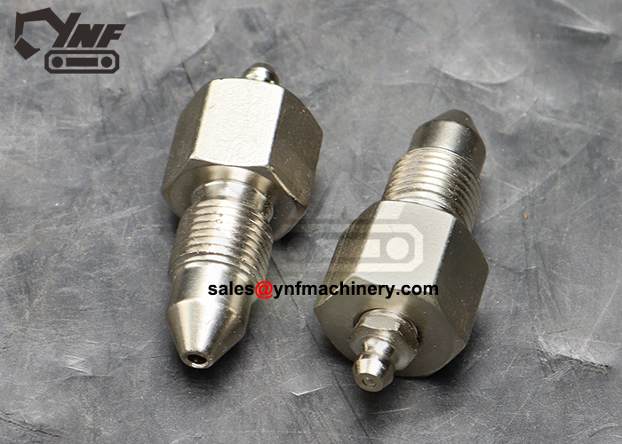 Track tension grease fitting for excavator maintenance
